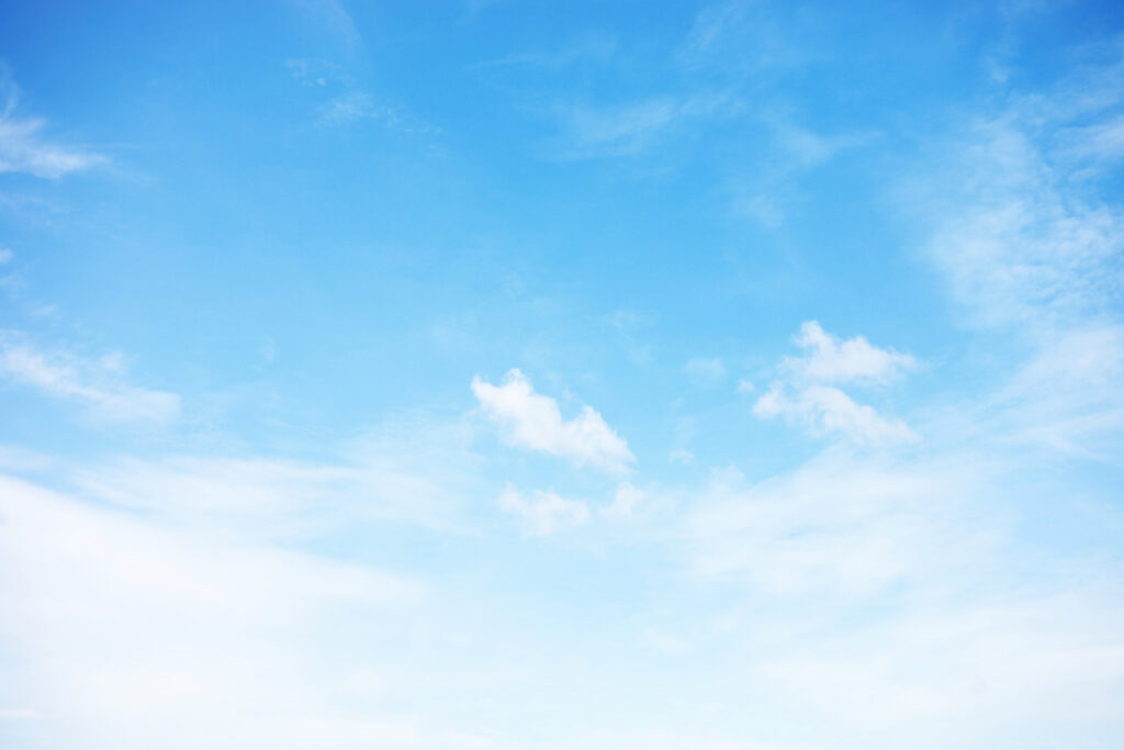Blue sky background and white clouds soft focus, and copy space